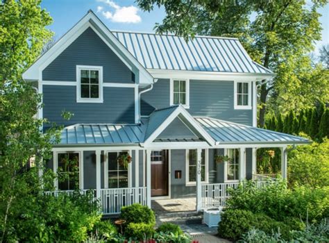 blue house white metal roof|white cottage with blue shutters.